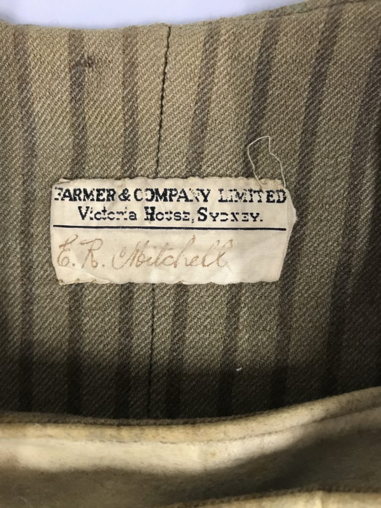 Close up of the manufacturer’s label on the centre back vest interior. Reads E. R. Mitchell.
